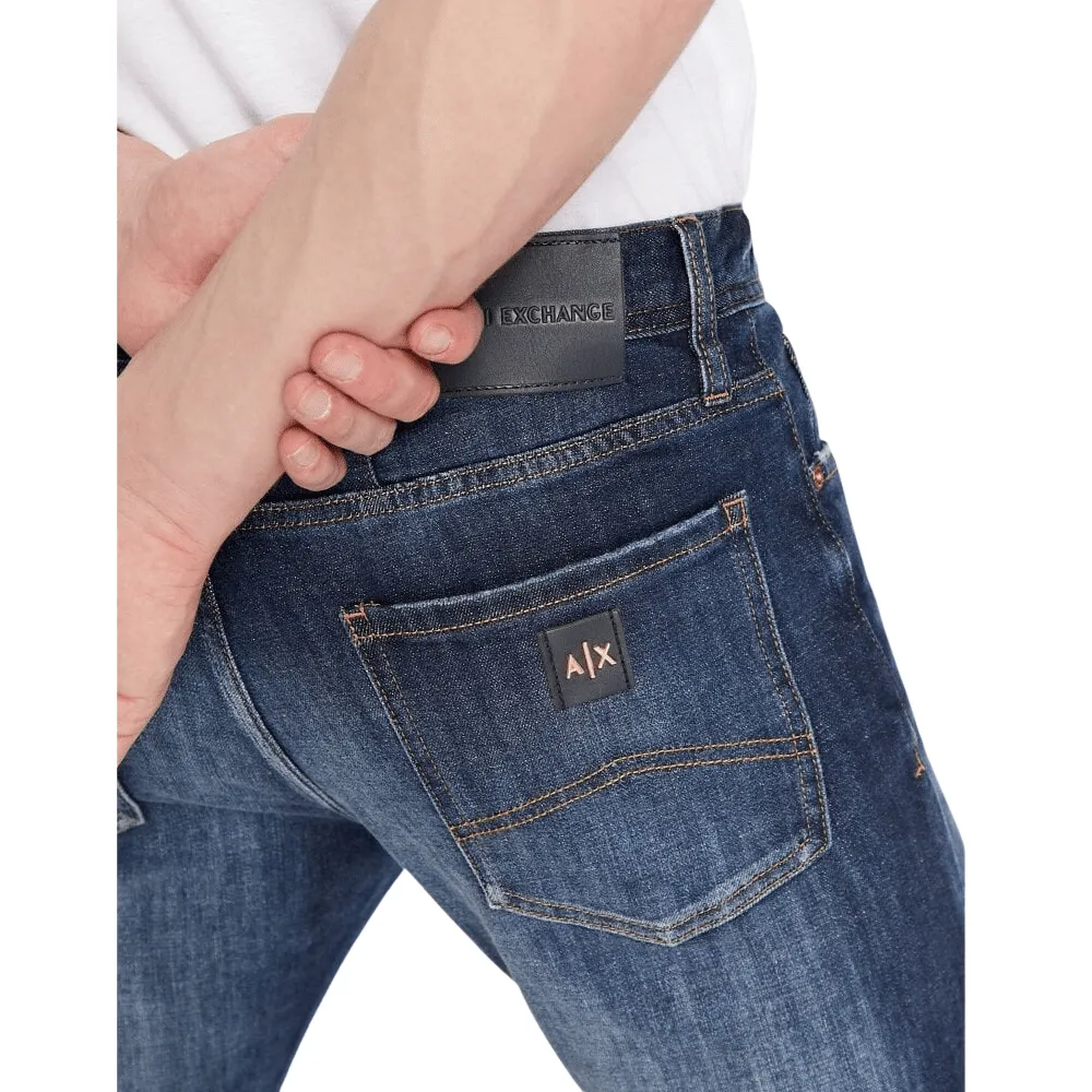 Armani Exchange Rose Gold Badge Slim-Fit Indigo FADE Jeans | Menswear Online